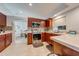 Well-lit kitchen featuring stainless steel appliances, granite countertops, and plenty of cabinet space at 5113 Sage Way, Kissimmee, FL 34758