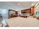 Lovely kitchen featuring granite countertops, stainless steel appliances, and rich cherry wood cabinets at 5113 Sage Way, Kissimmee, FL 34758