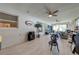 Bright and airy living room featuring wood-look floors, ceiling fan, and comfortable seating at 5113 Sage Way, Kissimmee, FL 34758