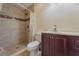 Modern bathroom featuring a tiled walk-in shower and a stylish vanity with vessel sink at 5445 Marvell Ave, Orlando, FL 32839