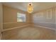 Serene bedroom space, complete with large window, tile floor, and modern light fixture at 5445 Marvell Ave, Orlando, FL 32839