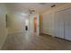 Bright bedroom featuring tile flooring, closet space, and a ceiling fan at 5445 Marvell Ave, Orlando, FL 32839