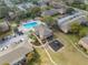 Aerial view of a community pool, playground, parking, and landscaped grounds at 562 Flemming Way # 200, Maitland, FL 32751