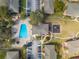 Aerial view of a community pool, playground, parking, and landscaped grounds at 562 Flemming Way # 200, Maitland, FL 32751