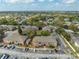 Aerial view of well-maintained apartment complex, ample parking, and lush landscaping create a welcoming community atmosphere at 562 Flemming Way # 200, Maitland, FL 32751