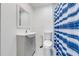 Bathroom featuring a sink, toilet, mirror and blue and white shower curtain at 562 Flemming Way # 200, Maitland, FL 32751