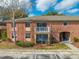 Charming red brick two-story home featuring a balcony and covered patio at 562 Flemming Way # 200, Maitland, FL 32751