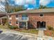 Charming red brick two-story home featuring a balcony and covered patio at 562 Flemming Way # 200, Maitland, FL 32751