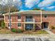 Charming two-story condo featuring a brick facade, balcony, and well-maintained landscaping at 562 Flemming Way # 200, Maitland, FL 32751