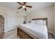 A cozy bedroom features a rustic wood bed frame and dresser with light-colored flooring at 562 Flemming Way # 200, Maitland, FL 32751