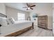 A bright bedroom showcases modern furnishings, a ceiling fan, and neutral decor for a comfortable retreat at 562 Flemming Way # 200, Maitland, FL 32751