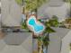 Aerial view of an inviting blue community pool surrounded by lush landscaping at 562 Flemming Way # 200, Maitland, FL 32751