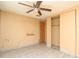 Bedroom with wood-look tile, ceiling fan, closet, and neutral-colored walls at 6332 Bayberry Ne Blvd, Winter Haven, FL 33881