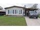 Exterior of home featuring mature lawn and driveway with ample parking at 6332 Bayberry Ne Blvd, Winter Haven, FL 33881
