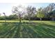 Expansive grassy lot with mature trees, offering a peaceful and serene setting at 6332 Bayberry Ne Blvd, Winter Haven, FL 33881