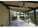 Enclosed lanai featuring ceiling fans, screens, and neutral paint scheme at 6332 Bayberry Ne Blvd, Winter Haven, FL 33881