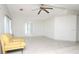 Bright living room with tile flooring and a cozy yellow armchair at 6332 Bayberry Ne Blvd, Winter Haven, FL 33881