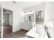 Bathroom featuring double vanity, soaking tub, and bright natural light at 6430 Sw 144Th Street Rd, Ocala, FL 34473