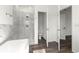 Bathroom featuring walk-in shower, toilet, and view of bedroom at 6430 Sw 144Th Street Rd, Ocala, FL 34473