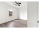 Cozy bedroom featuring a ceiling fan, a window with natural light, and wood-look flooring at 6430 Sw 144Th Street Rd, Ocala, FL 34473