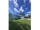 View of the yard featuring green grass and a new construction house at 6430 Sw 144Th Street Rd, Ocala, FL 34473