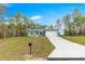 Inviting single-story home with well-maintained lawn, driveway, and a mailbox at 6430 Sw 144Th Street Rd, Ocala, FL 34473