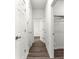 Bright hallway features modern wood flooring and white doors at 6430 Sw 144Th Street Rd, Ocala, FL 34473