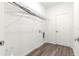 The bright laundry room features a white door and wire shelving at 6430 Sw 144Th Street Rd, Ocala, FL 34473