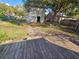 Backyard featuring a spacious deck and additional outbuilding at 713 Illinois Ave, St Cloud, FL 34769