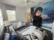 Bedroom with two twin beds and a Harry Potter mural at 723 Tuscan Hills Blvd, Davenport, FL 33897