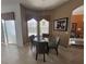 Breakfast nook with small table, three windows, and tile flooring at 723 Tuscan Hills Blvd, Davenport, FL 33897