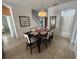 Dining table with seating for six and tiled floors at 723 Tuscan Hills Blvd, Davenport, FL 33897