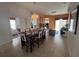 Open-concept dining area with tile flooring and elegant chandelier at 723 Tuscan Hills Blvd, Davenport, FL 33897