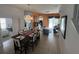 Open-concept dining area with tile flooring and elegant chandelier at 723 Tuscan Hills Blvd, Davenport, FL 33897