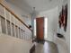 Inviting home entryway featuring a staircase and tile flooring, leading to the main living areas at 723 Tuscan Hills Blvd, Davenport, FL 33897