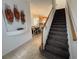 Hallway view showcases stairway and a dining room with a decorative wall fixture at 723 Tuscan Hills Blvd, Davenport, FL 33897