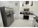 Modern kitchen featuring stainless steel appliances and white cabinets at 723 Tuscan Hills Blvd, Davenport, FL 33897