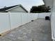 Wide backyard with white vinyl fencing at 7860 Kensingham Ct, Orlando, FL 32835