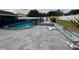 Backyard pool with paver patio and tropical landscaping and privacy fence at 7860 Kensingham Ct, Orlando, FL 32835