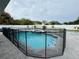 Backyard pool enclosed by fence with a patio, landscaping, and a surrounding privacy fence at 7860 Kensingham Ct, Orlando, FL 32835