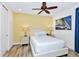 Bedroom with wood-look flooring and a large window provides lots of natural light at 8165 Surf St, Kissimmee, FL 34747