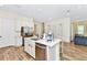 Stylish kitchen island featuring stainless steel dishwasher and modern countertops at 8165 Surf St, Kissimmee, FL 34747