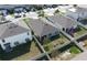 A high aerial view showing the backyard and neighboring properties at 9009 Pinales Way, Kissimmee, FL 34747