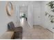 Inviting hallway featuring neutral tile flooring and arched doorways at 9009 Pinales Way, Kissimmee, FL 34747