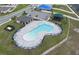 Aerial view of a community pool and lounge area with chairs and tables for residents to relax at 953 Cambridge Dr, Winter Haven, FL 33881