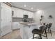 Kitchen island with granite countertops, stainless steel appliances, pendant lighting, and breakfast bar seating at 953 Cambridge Dr, Winter Haven, FL 33881