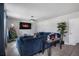 Comfortable living room features plush blue seating, a ceiling fan, and a festive Christmas tree at 953 Cambridge Dr, Winter Haven, FL 33881