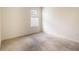 Simple bedroom with carpet and bright natural light from the bright window at 1031 August Sky Dr, Deltona, FL 32738