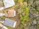 Aerial shot of the property and backyard, with a view of the wooded area to the right of the yard at 10409 Laxton St, Orlando, FL 32824