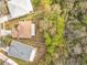 Aerial view of the home showcasing the roof, backyard, and surrounding trees at 10409 Laxton St, Orlando, FL 32824